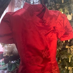 Mandarin color gorgeous deep red dress .